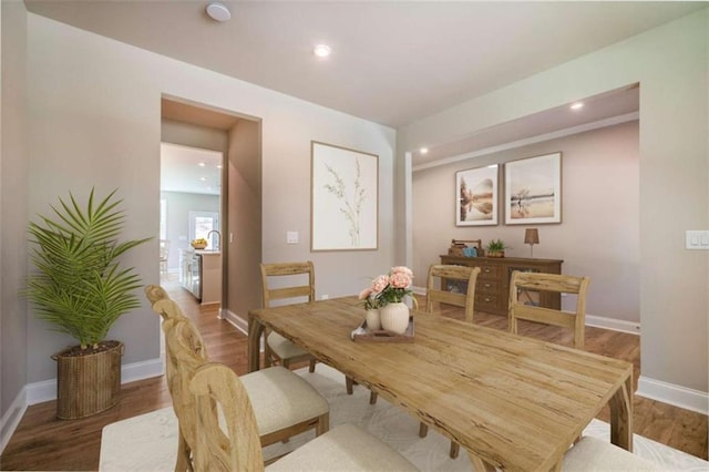 dining area featuring hardwood / wood-style floors