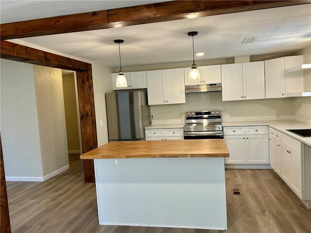 kitchen featuring wood counters, decorative light fixtures, a center island, stainless steel appliances, and white cabinets