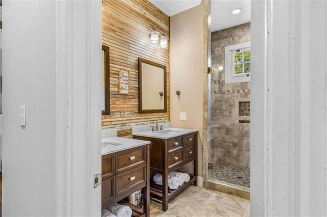 bathroom featuring wooden walls, vanity, and walk in shower