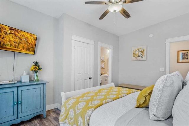 bedroom featuring connected bathroom, hardwood / wood-style flooring, and ceiling fan