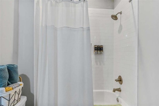 bathroom featuring shower / bathtub combination with curtain