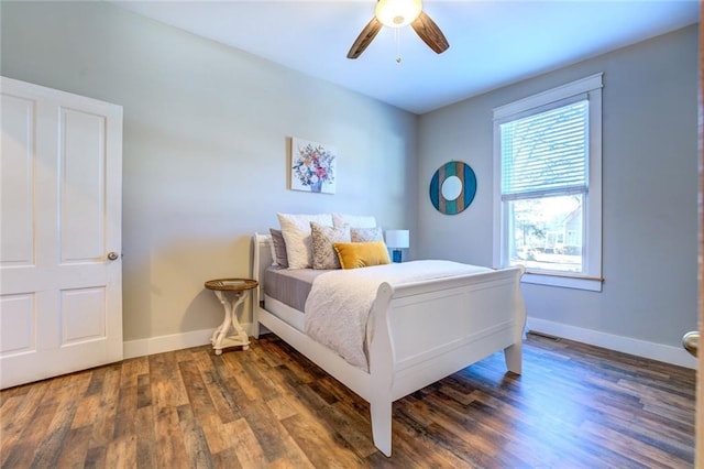 bedroom with ceiling fan and dark hardwood / wood-style floors