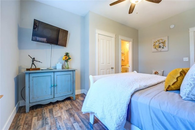 bedroom featuring dark hardwood / wood-style floors, ensuite bath, and ceiling fan