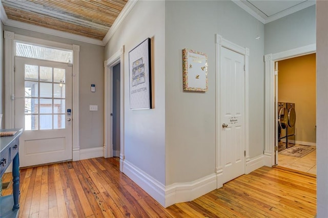 interior space with separate washer and dryer, a healthy amount of sunlight, and light hardwood / wood-style floors