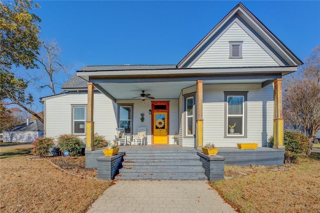 bungalow-style house with ceiling fan and covered porch