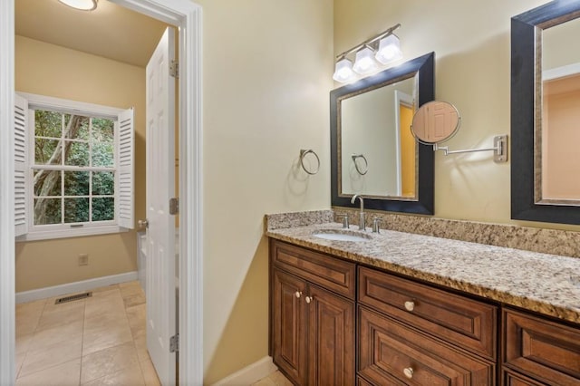 bathroom with vanity and tile patterned flooring