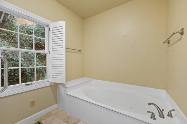 bathroom featuring a bathtub and tile patterned flooring