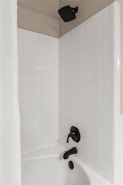 interior details featuring shower / bath combo with shower curtain