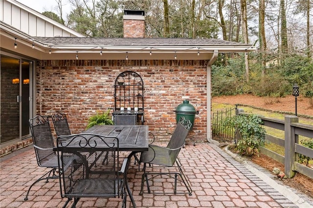 view of patio / terrace featuring fence and outdoor dining area