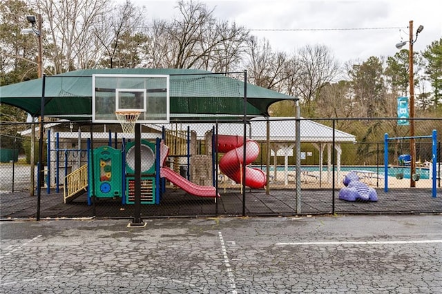 community jungle gym featuring fence