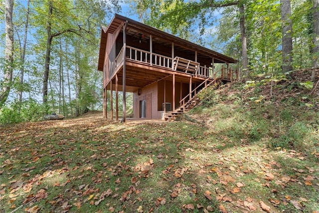 rear view of house with a wooden deck