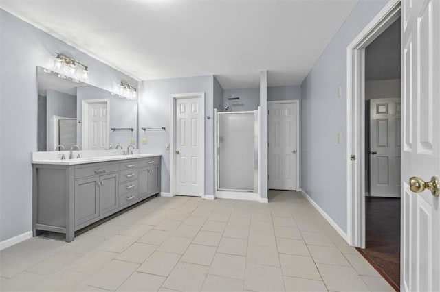 bathroom featuring an enclosed shower and vanity