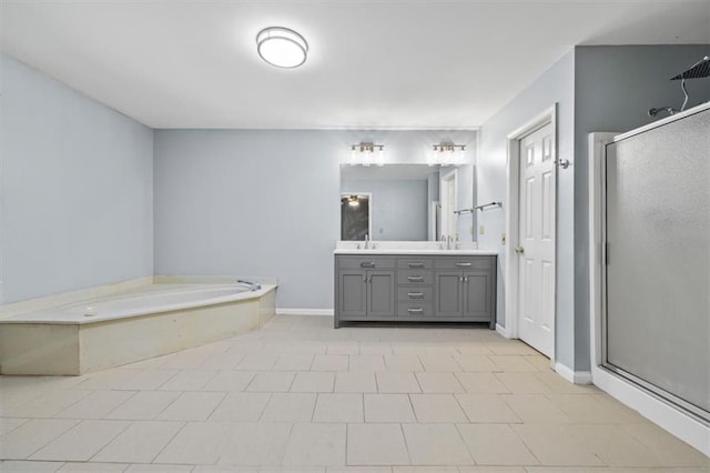 bathroom with vanity and independent shower and bath