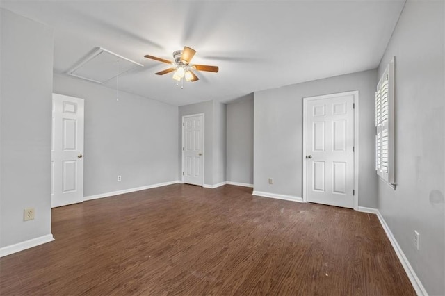 empty room featuring ceiling fan and dark hardwood / wood-style flooring