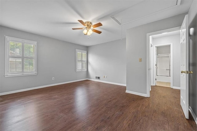 spare room featuring ceiling fan and dark hardwood / wood-style flooring