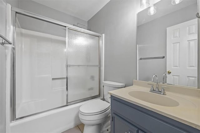 full bathroom with vanity, toilet, and combined bath / shower with glass door