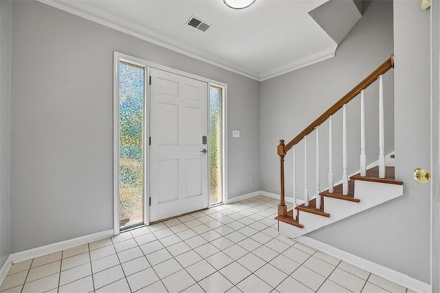 entrance foyer featuring light tile patterned flooring and ornamental molding