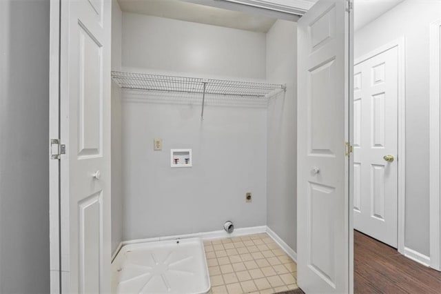 washroom featuring tile patterned floors and hookup for a washing machine