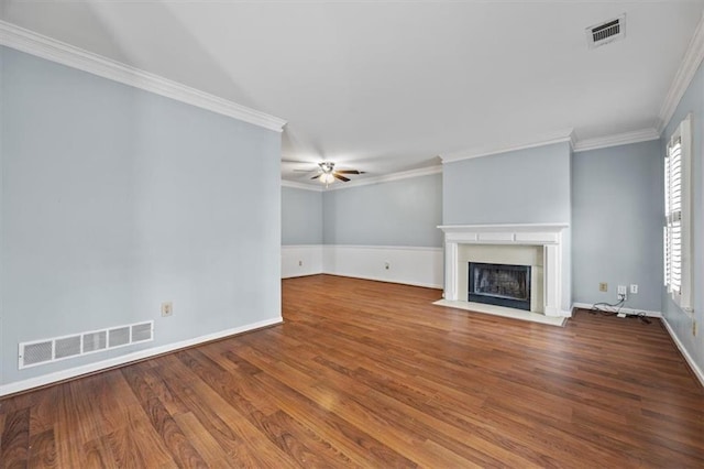 unfurnished living room featuring ceiling fan, ornamental molding, and hardwood / wood-style floors