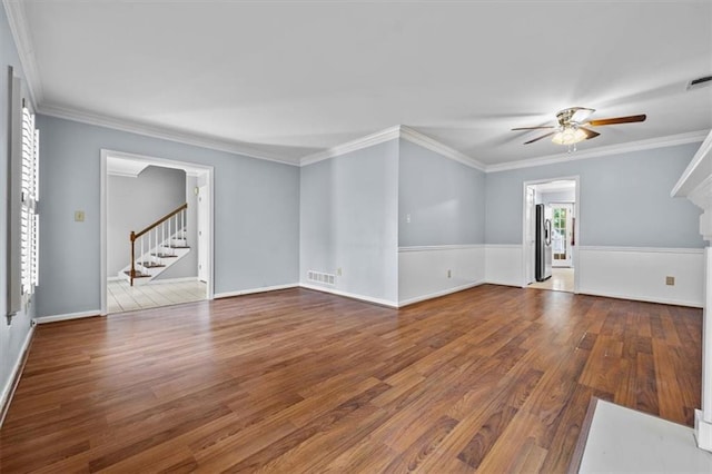 unfurnished living room featuring crown molding, ceiling fan, and hardwood / wood-style flooring