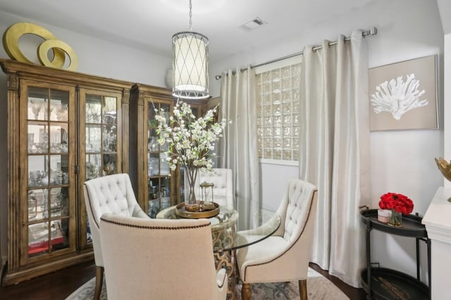 dining area featuring dark hardwood / wood-style flooring