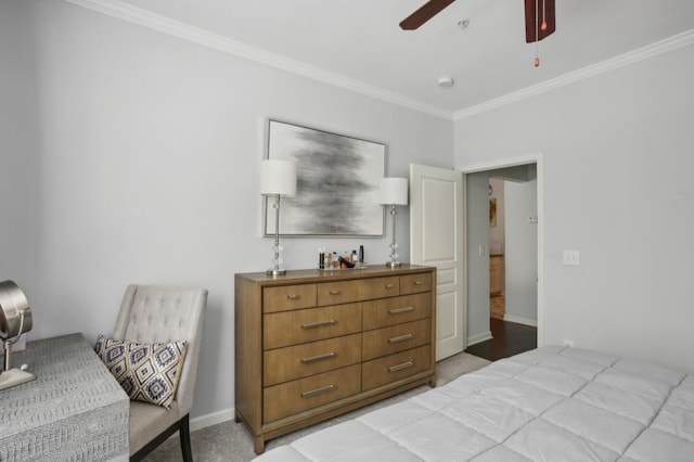 bedroom featuring crown molding, light colored carpet, and ceiling fan