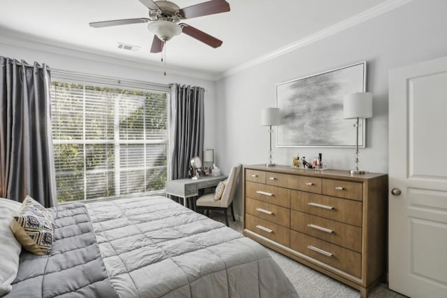 carpeted bedroom with crown molding and ceiling fan