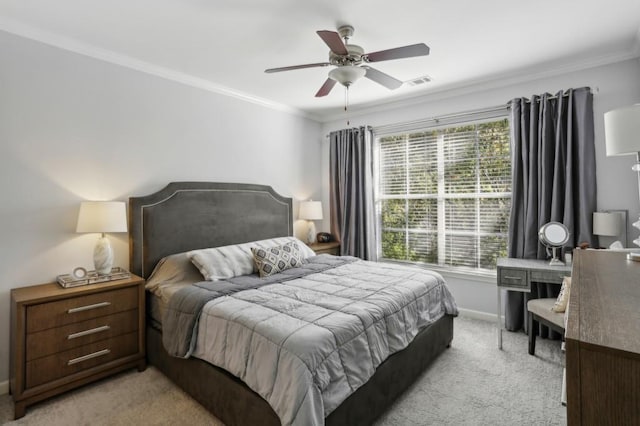 carpeted bedroom with crown molding and ceiling fan