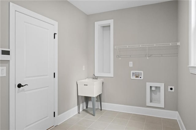 laundry room with light tile patterned floors, hookup for a washing machine, hookup for an electric dryer, laundry area, and baseboards