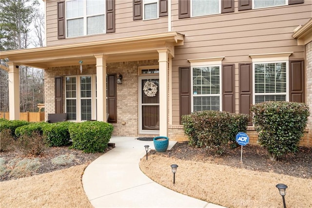 property entrance with covered porch