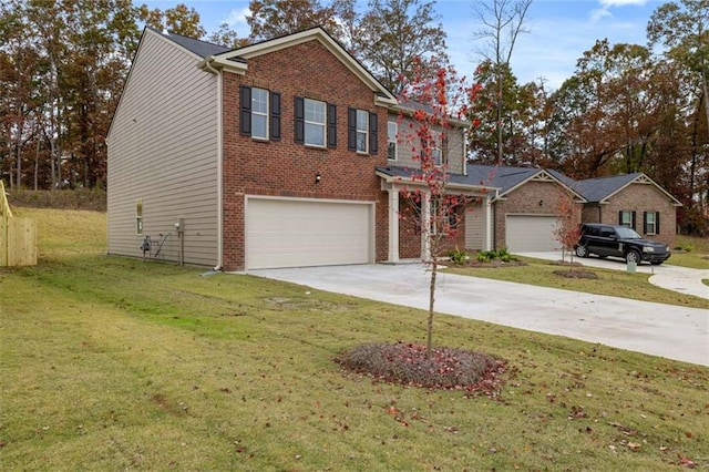 traditional-style house with a garage, a front lawn, concrete driveway, and brick siding