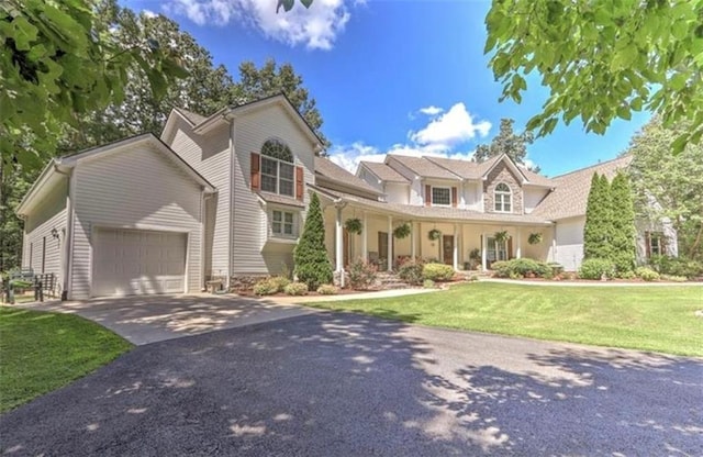 2203 Arbor Hill Rd, Canton, GA 30115 - traditional-style home featuring driveway, a garage, and a front lawn