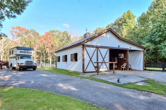 2203 Arbor Hill Rd, Canton, GA 30115 - view of front of property with fence and an outbuilding