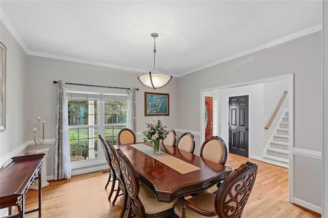 2203 Arbor Hill Rd, Canton, GA 30115 - dining room with light wood-type flooring, stairway, and ornamental molding