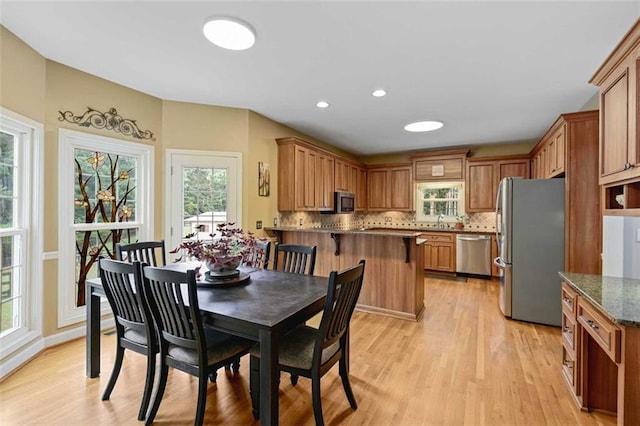 2203 Arbor Hill Rd, Canton, GA 30115 - dining area featuring healthy amount of natural light, light wood finished floors, and recessed lighting