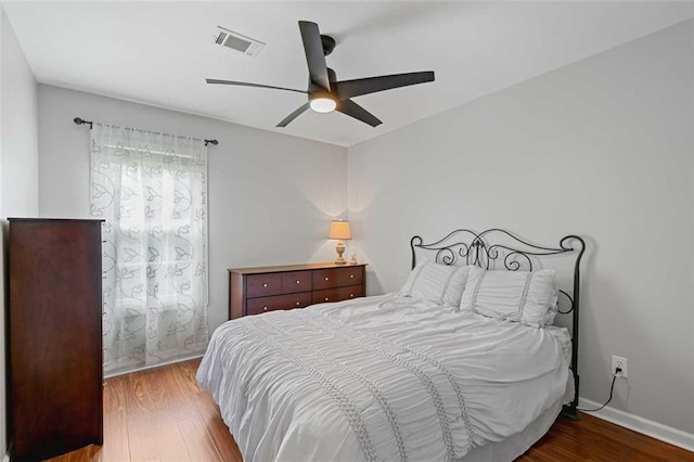 2203 Arbor Hill Rd, Canton, GA 30115 - bedroom with wood finished floors, a ceiling fan, and baseboards