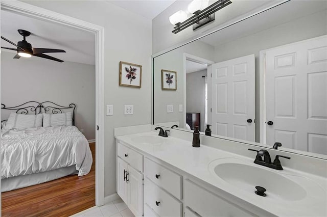 2203 Arbor Hill Rd, Canton, GA 30115 - ensuite bathroom with double vanity, a ceiling fan, baseboards, and tile patterned floors