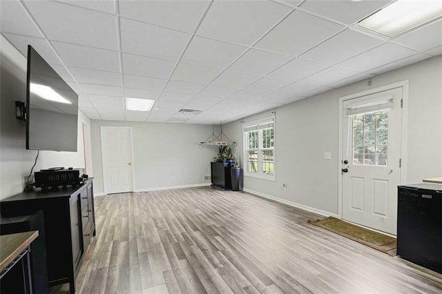 2203 Arbor Hill Rd, Canton, GA 30115 - kitchen with dark cabinets, light wood finished floors, a drop ceiling, refrigerator, and baseboards