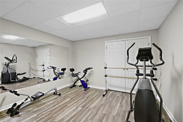 2203 Arbor Hill Rd, Canton, GA 30115 - workout room with baseboards, light wood finished floors, and a drop ceiling