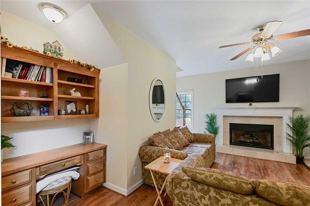2203 Arbor Hill Rd, Canton, GA 30115 - living area with light wood-type flooring, ceiling fan, a fireplace, and baseboards