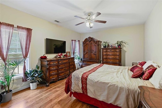 2203 Arbor Hill Rd, Canton, GA 30115 - bedroom with light wood-style floors, ceiling fan, and baseboards