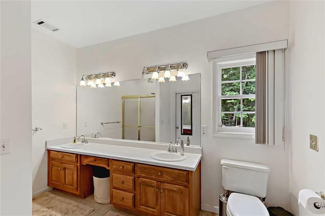 2203 Arbor Hill Rd, Canton, GA 30115 - full bath featuring a stall shower, toilet, double vanity, tile patterned floors, and baseboards