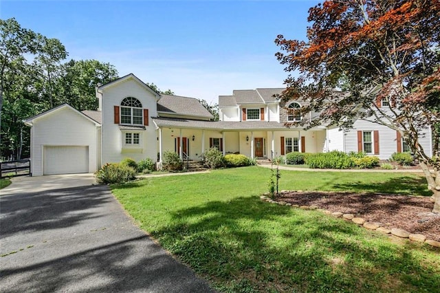 2203 Arbor Hill Rd, Canton, GA 30115 - view of front facade with a front lawn, asphalt driveway, a garage, and covered porch