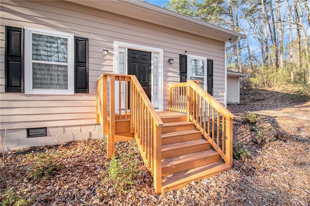 doorway to property featuring crawl space