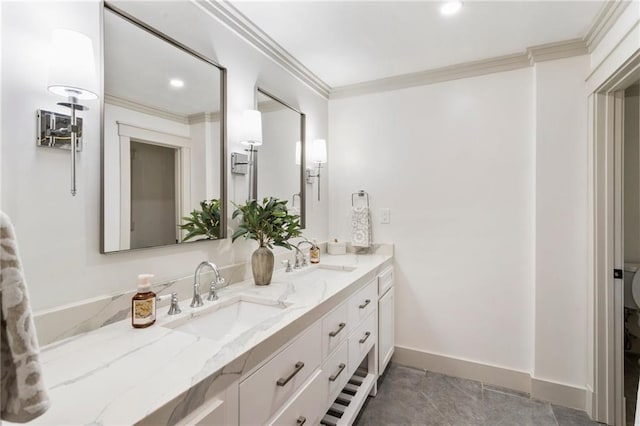 bathroom featuring a sink and crown molding