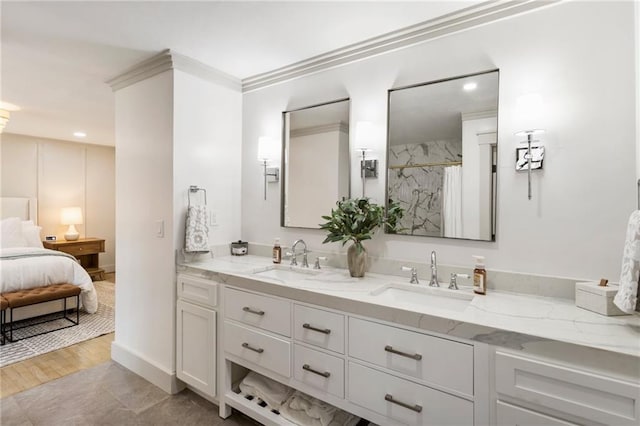 full bath with double vanity, ensuite bath, a sink, and a shower with shower curtain