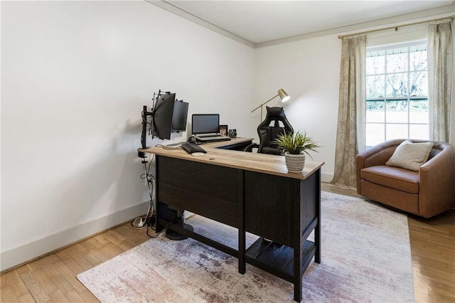 office featuring baseboards, crown molding, and wood finished floors