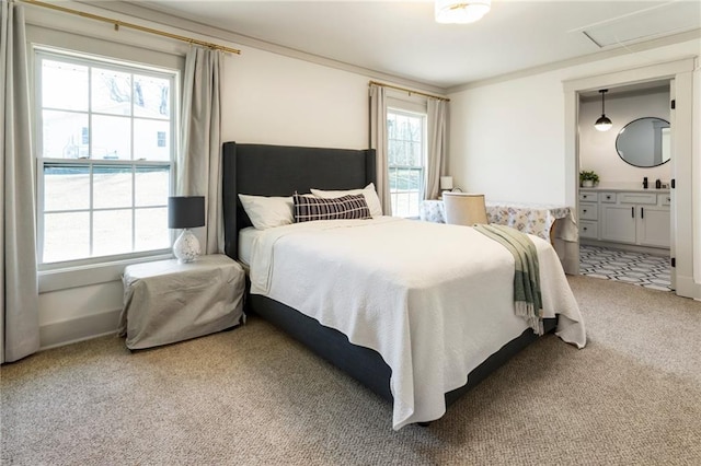 bedroom with ensuite bathroom, carpet floors, ornamental molding, and baseboards