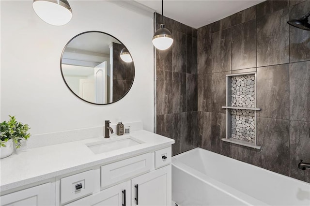 bathroom featuring washtub / shower combination and vanity