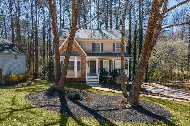 view of front of house featuring a porch and a front yard